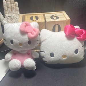 Two hello kitty plushies